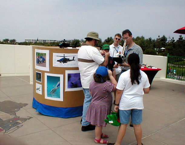 Bram Lambrecht and Terry Keller talk about their creations and rendered posters on display at the event.