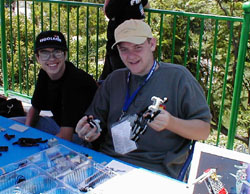 Thomas Michon and Tim Courtney build Jin Sato's MIBO robotic dog.