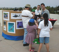 Terry Keller explains LDraw to a few guests, while showing his models